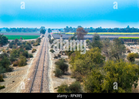 railroad railway line in pakistan countryside seen from railway bridge. Stock Photo