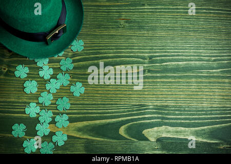 lucky green hat for st. patricks day on green wood background Stock Photo