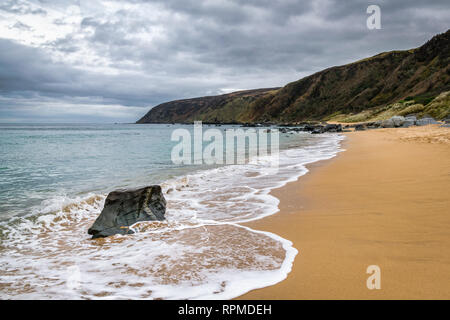 This is a picture of the sandy beach at Kinnagoe Bay in Doengal Ireland Stock Photo