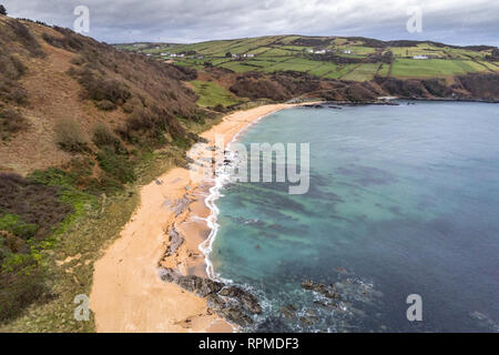 This is an aerial photograph of Kinnageo Beach on the Inishowen peninsula in Donegal Ireland.  It shows the crystal clear turquoise water of the Atlan Stock Photo