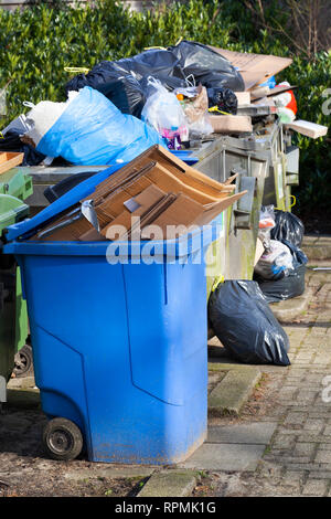 Overloaded trash bin in a street in the dutch city Haarlem Stock Photo ...