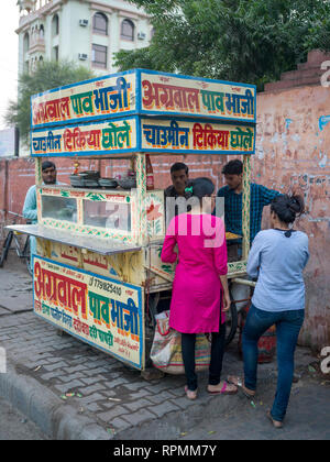 People at food stall at roadside, Jaipur, Rajasthan, India Stock Photo