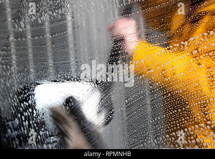 Self Car washing/ High-pressure washing of a car wing mirror Stock Photo