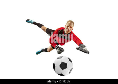 Male soccer player goalkeeper catching ball in jump. Silhouette of fit man with ball isolated on white studio background Stock Photo