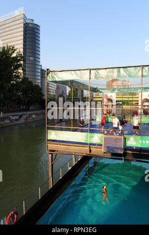 The swimming pool floating on the Danube canal and the football pitch on top at Badeschiff, Vienna, Austria Stock Photo