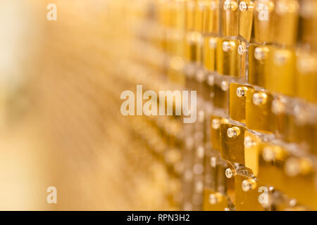 golden mosaic interior. Abstract golden background of sparkling Christmas lights. Stock Photo