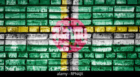 National flag of Dominica on a brick background. Concept image for Dominica: language , people and culture. Stock Photo