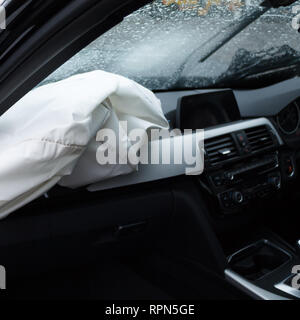 Car crash. Airbags deployed by a road traffic accident in the UK. Close up damage and details on modern vehicle. Shattered windscreen. Car insurance. Stock Photo
