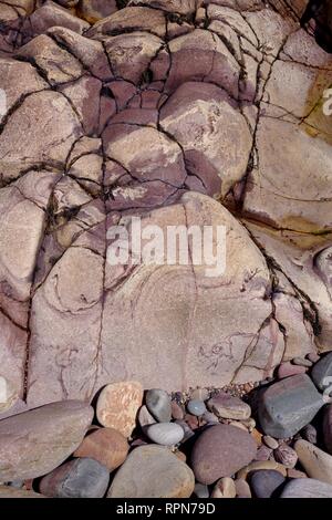 Natural Background of  Red Mottled Carboniferous Sandstone Geology along the Fife Coast. Scotland, UK. Stock Photo