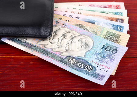 Old Chinese money in the black wallet Stock Photo