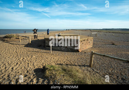 Half buried WW2 pillbox on Cley next the Sea beach, Norfolk, Uk Stock Photo