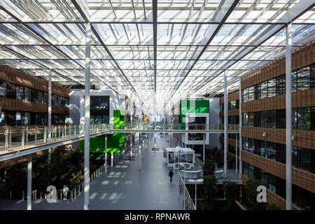 Elevated overall view with bridges and glass roof. Research Centre of the Urbalad Campus, Michelin, Cebazat, France. Architect: Chaix & Morel et Assoc Stock Photo