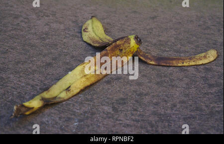 Close up view of dirty abandoned banana peels on street Stock Photo