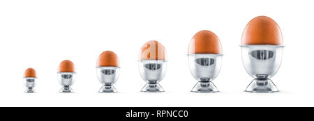 Six eggs in egg cups isolated on white background. Stock Photo