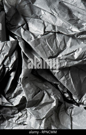 background made of a closeup of a crumpled gray paper Stock Photo
