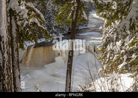 Paradise, Michigan - Tahquamenon Falls in winter. The falls are located in Tahquamenon Falls State Park, in Michigan's upper peninsula. Stock Photo