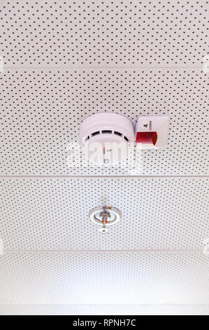 Israel, Arava - 04 December 2018: Smoke detector and sprinkler installed in dropped ceiling, Arava, Israel Stock Photo