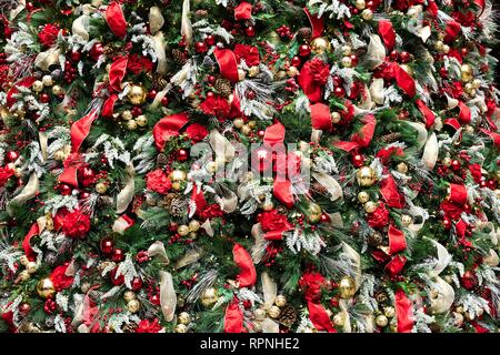 Full Frame Of Colorful Christmas Ornaments On Green Pine Tree Stock Photo