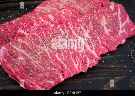 Raw Flap Steak Seasoned with Salt and Pepper Stock Photo