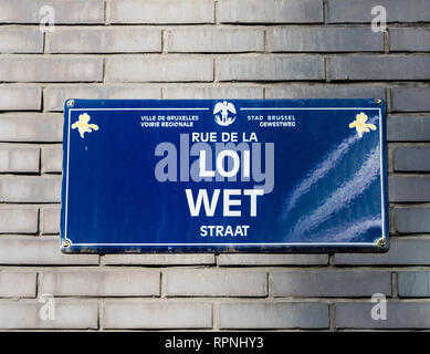City of Brussels / Belgium - 02 15 2019: Streetname tag on a brick facade of the Rue de la Loi - Wetstraat-  Law street in the European and business q Stock Photo