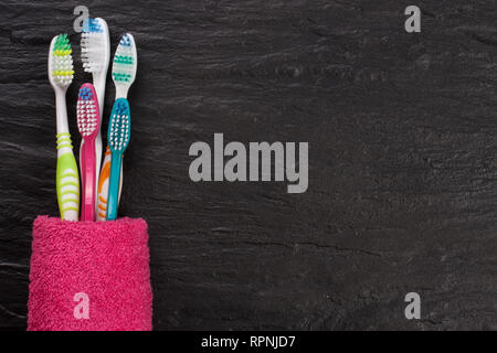 toothbrushes on the black stone background with copy space for your text. Top view Stock Photo