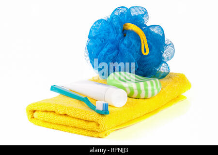 Hygiene products: soap, toothbrush and paste, loofah, towel isolated on white background Stock Photo