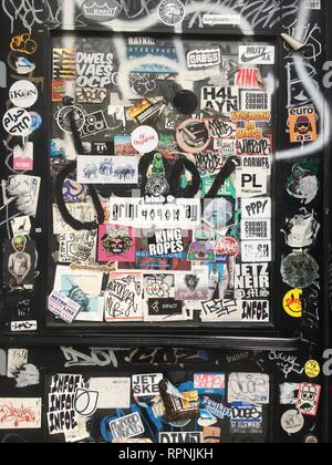 New York City, New York, USA. Nov 20, 2018. Graffiti and stickers adorn  a door in Brooklyn. Stock Photo