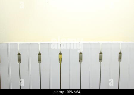 Close up of the upper part of the radiator, in white color aluminum. Stock Photo