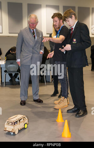 The Prince of Wales in his role of President, The Prince's Trust, is shown a remote control car built by students during a visit Ysgol Cwm Brombil co-educational school in Port Talbot, Wales, which is involved in delivering The Trust's Achieve programme. Stock Photo