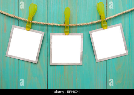 Empty picture frames hanging on rope Stock Photo