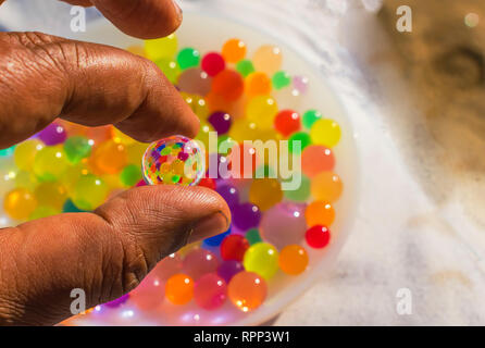 colorful balls reflection in hydrogel ball. Stock Photo
