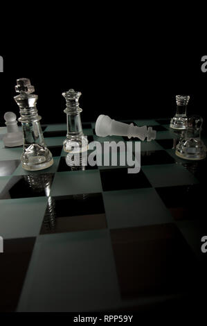 Checkmate Glass Chess Pieces Stock Photo