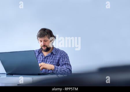 Businessman dressed casually. Office worker typing on laptop. Successful businessman working on laptop, computer. Effective work background. Office Stock Photo