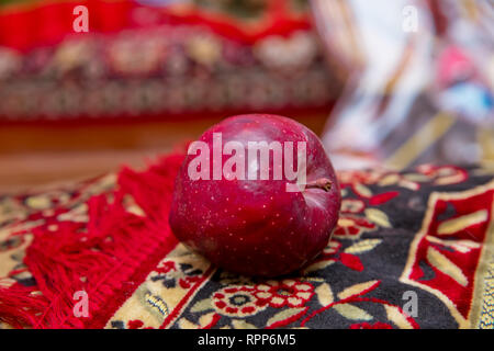 Large red apple in the carpet . Full depth of field. Autumn harvest concept - Fresh ripe organic red apple , dark stone background. Vegetarian, vegan, Stock Photo