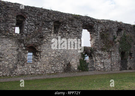 Italy, Brescia -December 31 2017: the view of the ancient wall and yard near Mirabella Tower in Brescia Castle on December 31 2017, Lombardy, Italy. Stock Photo
