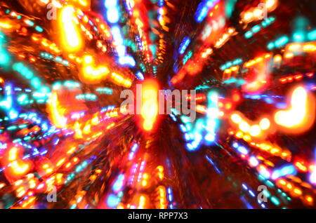 Multi-colored explosion of lights on dark background Stock Photo