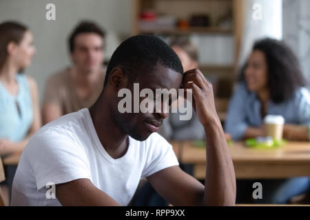 Sad African American man suffering from bullying or racial discrimination Stock Photo