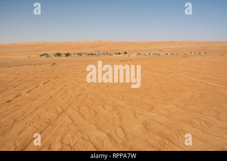 Wahiba Sand Desert and Bedouin camp in the morning (Oman) Stock Photo