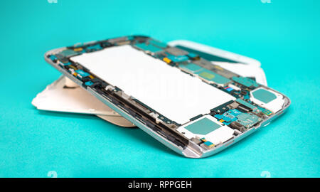 Close-up photos of disassembled mobile phone tablet. Tablet repair spare parts. Stock Photo