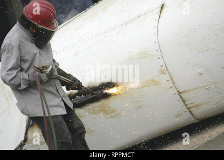 Davenport, Iowa, USA. 7th July, 2010. A worker from Precision Welding, Davenport, takes apart a toppled silo Wednesday, July 7, 2010, on the former River Gulf Grain property in Davenport. Credit: Rashah Mcchesney/Quad-City Times/ZUMA Wire/Alamy Live News Stock Photo