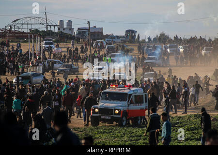 February 22, 2019 - Gaza, Palestine, 22nd February 2019. Clashes occur between Palestinian protesters and Israeli troops in the Abu Safiya area, on the east of Gaza City, during the 48th week of the Great March of Return protests. A 15-year-old boy, Yousef Said al-Daya, was shot in the chest during the protest, and succumbed to his wounds one hour later, while dozens of protesters were also injured by the Israeli army's tear gas and live fire. Thousands of demonstrators have gathered at several points near the fence separating Israel from Gaza this Friday with some burning tyres and throwing Stock Photo