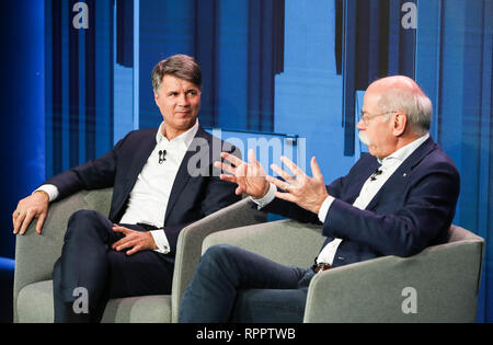 Berlin, Germany. 22nd Feb, 2019. Harald Krueger (L), management board chairman of BMW, and Dieter Zetsche, chairman of the board of management of Daimler, attend a press conference in Berlin, capital of Germany, on Feb. 22, 2019. Daimler and BMW, two German luxury carmakers, revealed on Friday their plans to invest more than one billion euros (1.13 billion U.S. dollars) in the establishment of a new joint car sharing business. Credit: Shan Yuqi/Xinhua/Alamy Live News Stock Photo