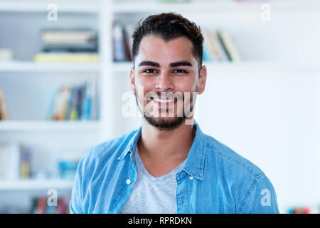 Portrait of mexican hipster man with beard indoor at home Stock Photo