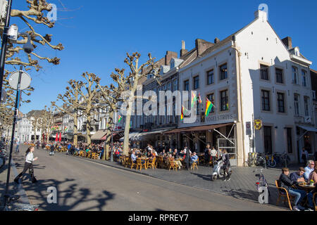 Vrijthof in Maastricht, with terraces full of people enjoying the first rays of sun in February. Signs of climate change and global heating Stock Photo