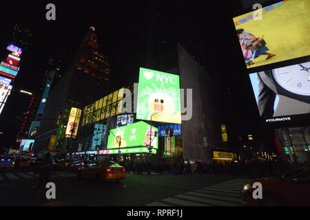 New York City,New York:USA. Nov. 20,2018. Taxis pass digital billboards  in Manhattan's Times Square at night. Stock Photo