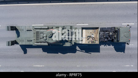 Returning from the Red Square after the Victory Day parade, the KamAZ-65225 truck carries the T-34-85 tank, from above. Stock Photo