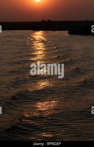 Sunset over the Chobe river in Chobe National Park, on the border of Botswana and Namibia Stock Photo
