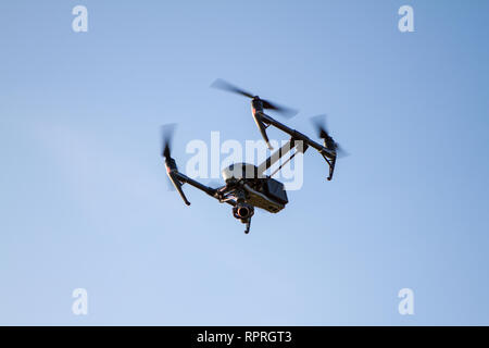 Drone quadcopter flying in the sky Stock Photo