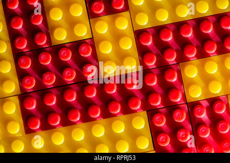 Plastic geometric cubes. Construction toy solid background from designer constructor. Multi-colored cubes. Geometric background. Children's toy. Circl Stock Photo