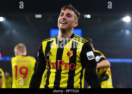 Watford's Gerard Deulofeu celebrates his side's fourth goal of the game with team-mate during the Premier League match at the Cardiff City Stadium. Stock Photo